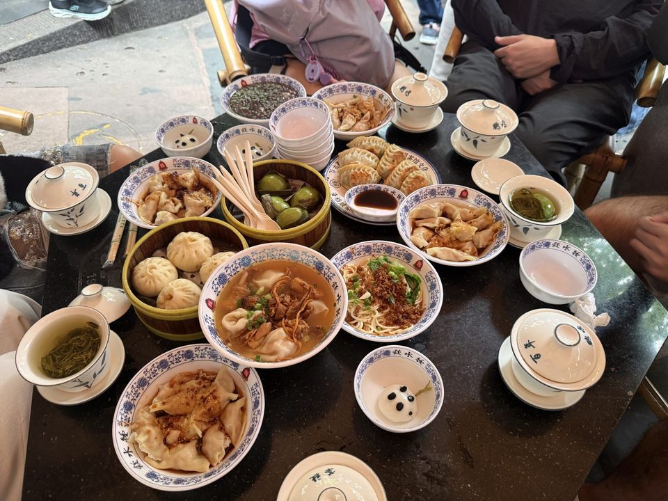 A table covered in Chengdu snacks