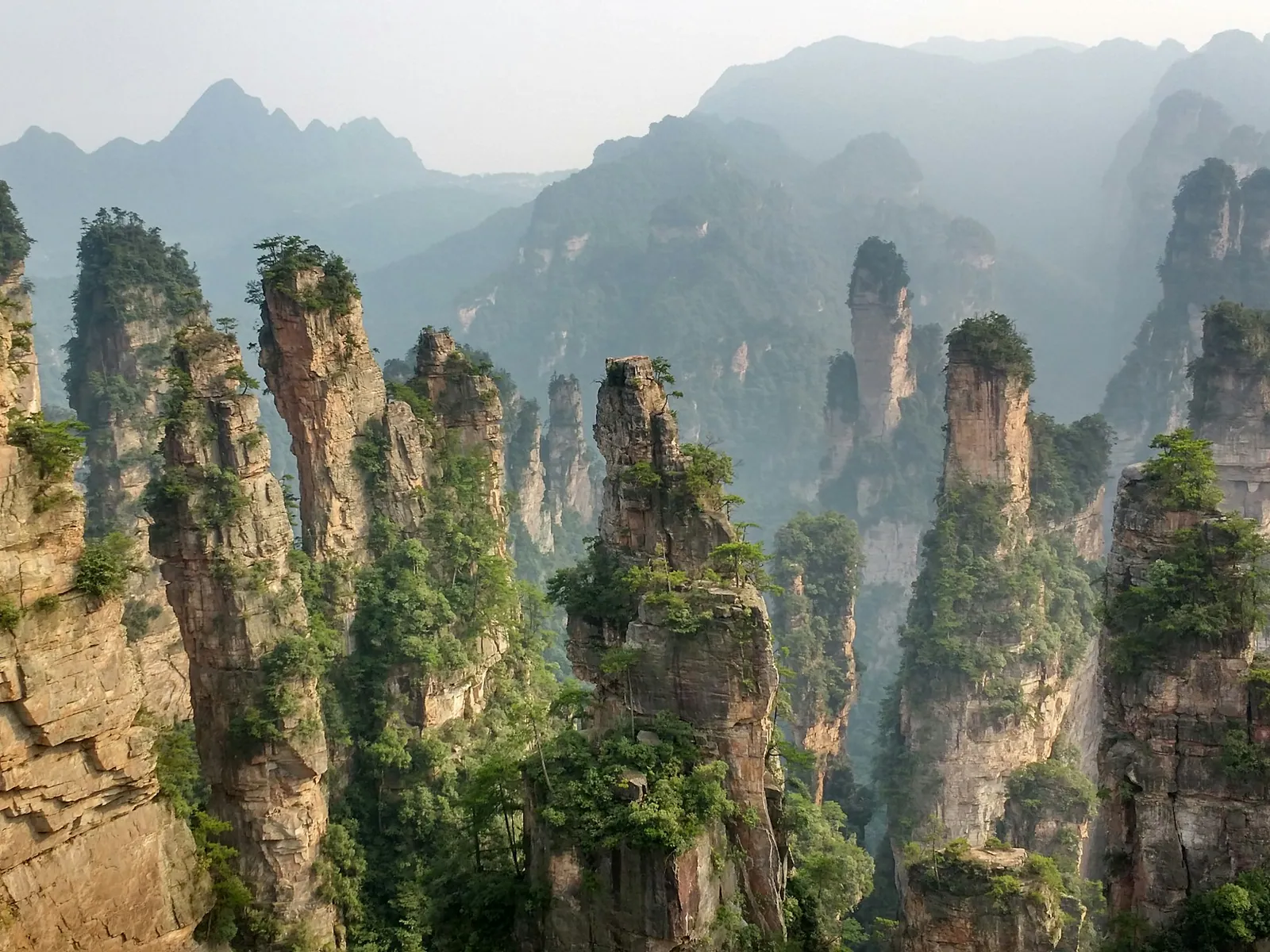 Sandstone pillars rising through mist in Zhangjiajie