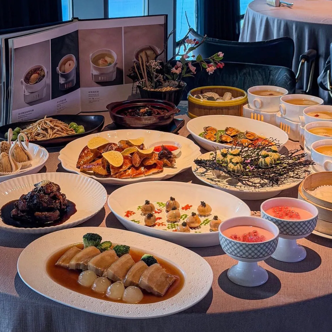 A dinner table set with Chinese dishes and soups