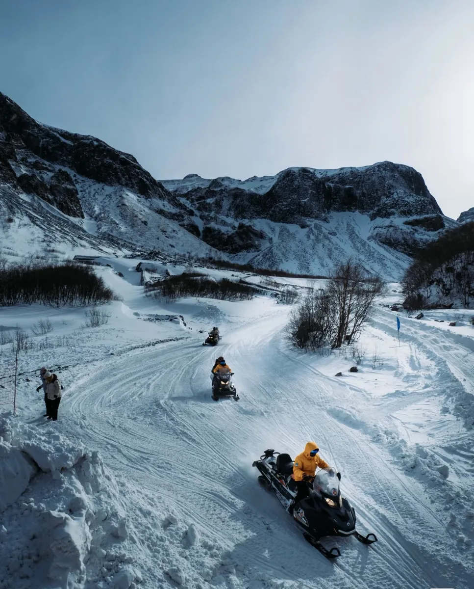 Snowmobile through the winter forest