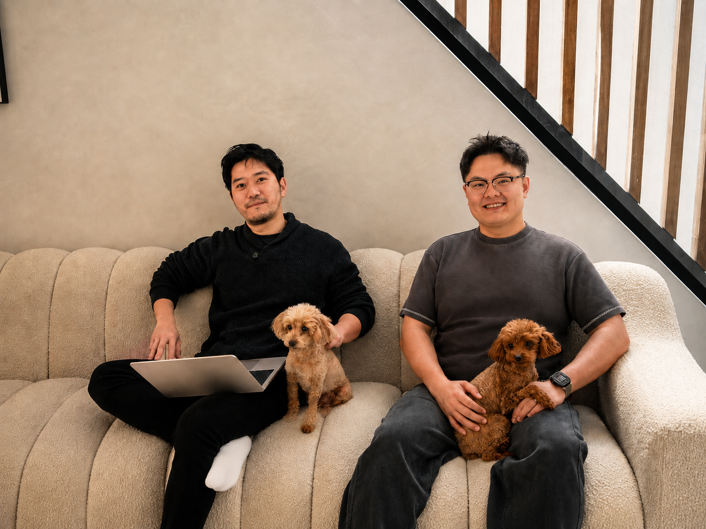 Frank and Leo seated together with their two toy poodles