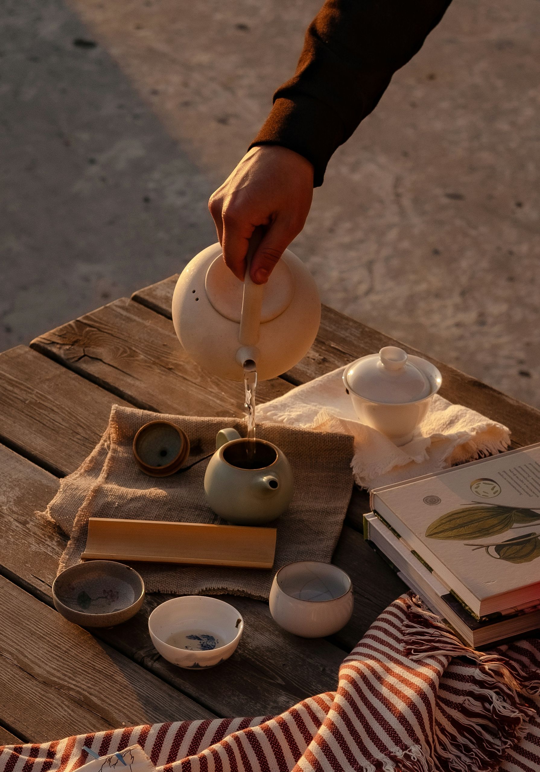 Chinese tea being poured at a tea table