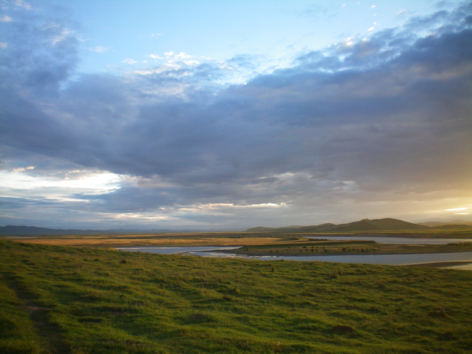 Wide grassland and river bend in the highlands of western Sichuan