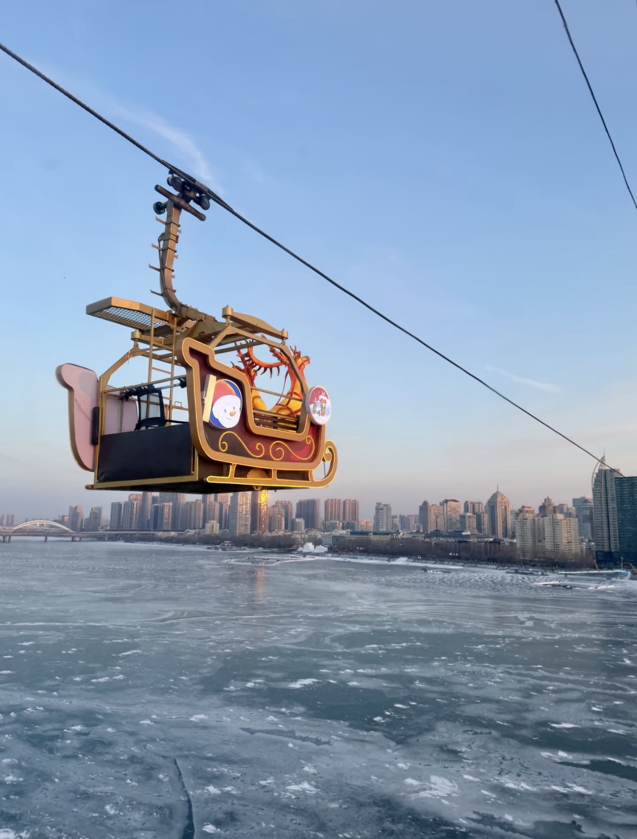 Cable car crossing the frozen Songhua River, Harbin